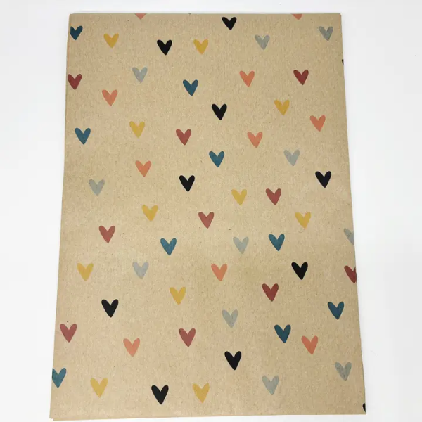 Eco-friendly wrapping paper from PlanetWrapit on brown kraft paper with colourful hearts
