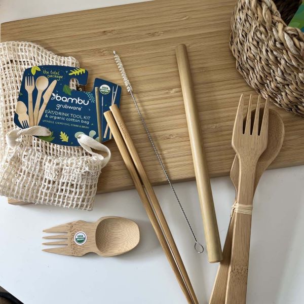 Travel eat and drink kit shown with each item laid alongside cotton net bag