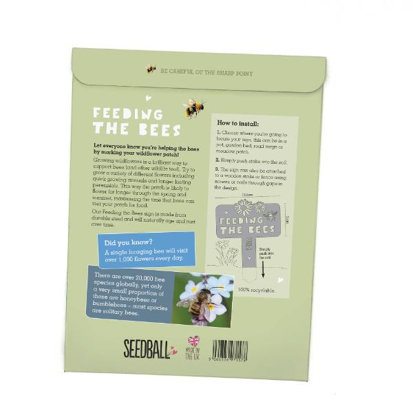 "Feeding the Bees" stainless steel sign by Seedball in cardboard packaging, showing back of pack