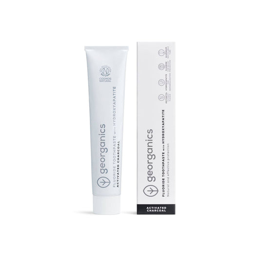 Georganics activated charcoal toothpaste tube and packaging on a white background