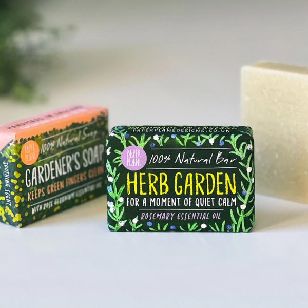 Gardener's soap bar alongside herb garden rosemary soap