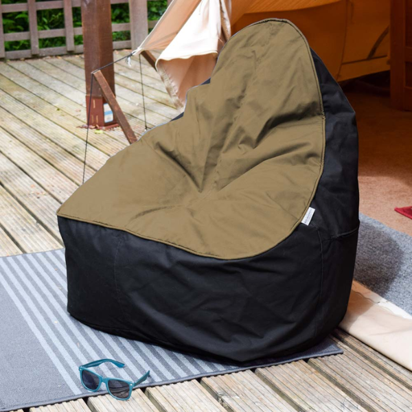 Outdoor bean bag Desert & Orca (desert seat and black base) outside a garden tent