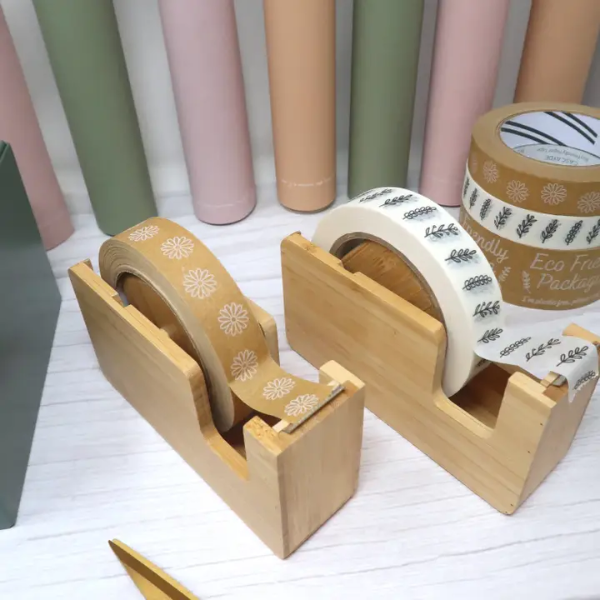 Bamboo tape dispenser shown with a brown roll with white flowers and a white roll inside ready to use