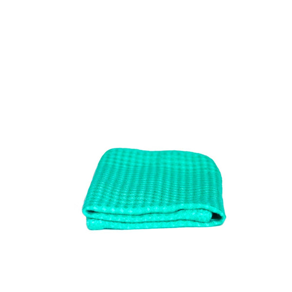 Bamboo cloth from Seep (teal coloured) shown folded on a white background