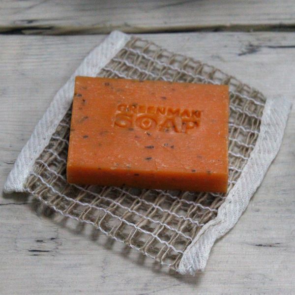 Jute soap bag shown with orange soap bar
