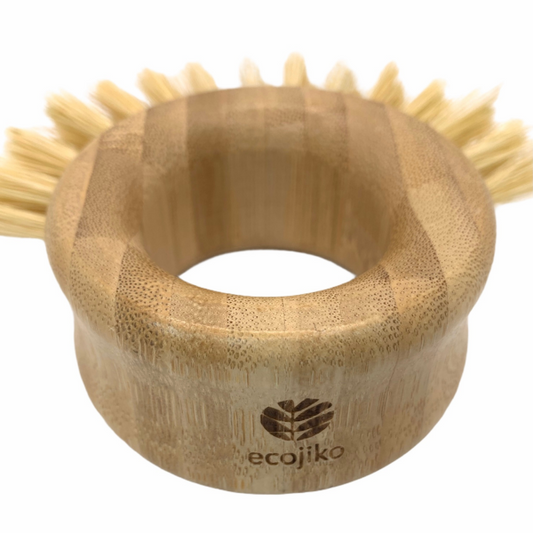 Bamboo vegetable brush shown close up with Ecojiko branding