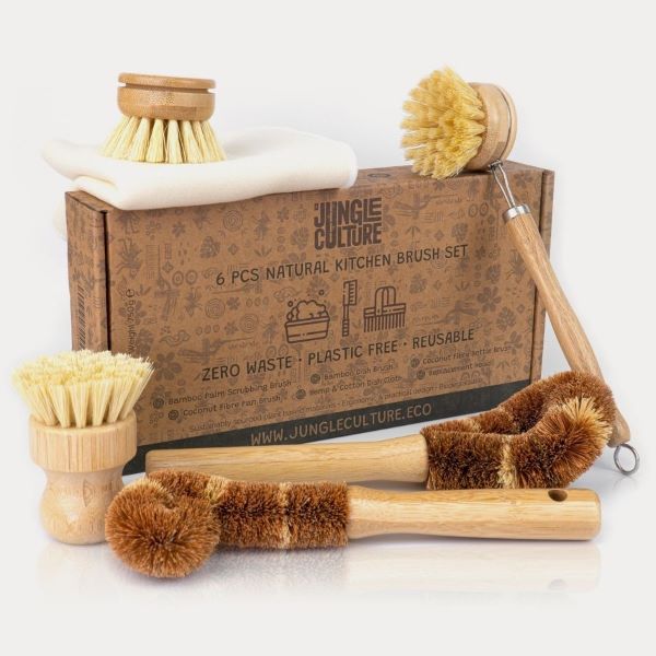 Jungle Culture's set of 6 bamboo and coconut fibre brushes sitting next to cardboard box packaging