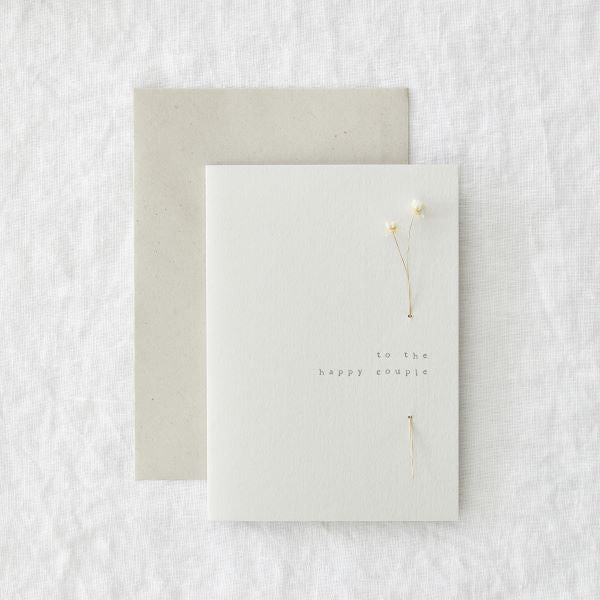 Eco card - love - wedding saying 'To the happy couple' with a real dried flower threaded through the card