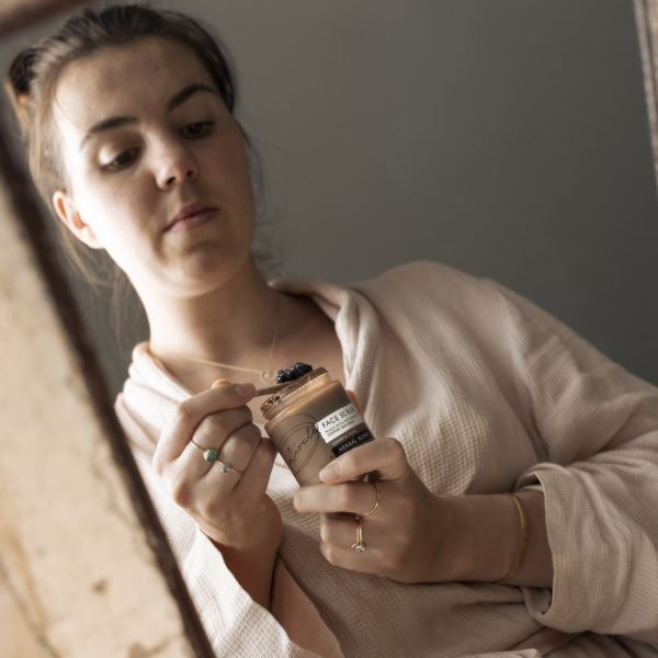 Girl holding coffee scrub pot