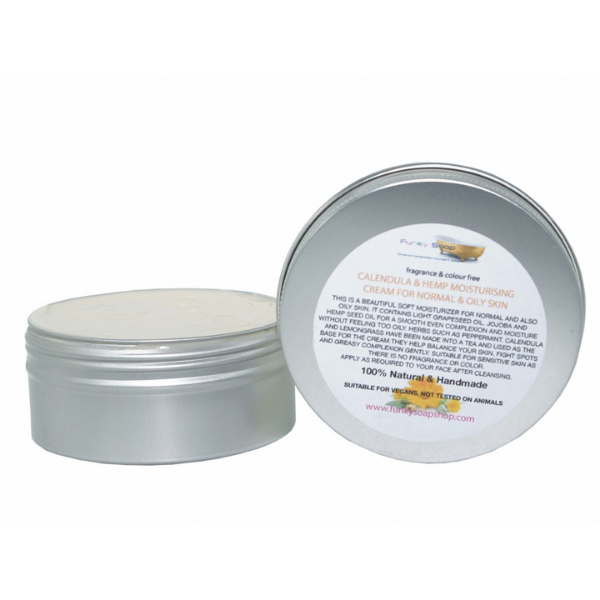 Face cream in aluminium tub Calendula and hemp shown with lid off and white cream inside