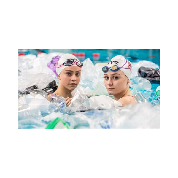 Synchronised swimmers in pool with plastic