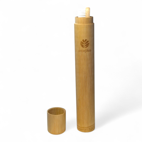 Bamboo toothbrush holder containing bamboo toothbrush with ecojiko branding on a white background