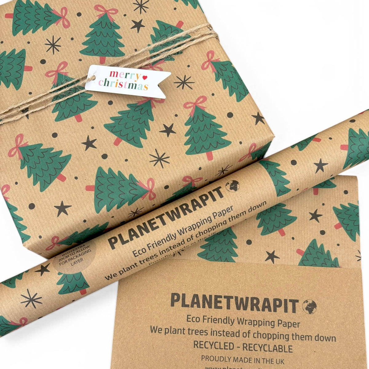 Planetwrapit Christmas-themed eco-friendly wrapping paper in brown kraft paper with green Christmas trees, shown wrapped around a gift. 