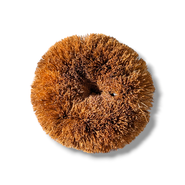 Coconut fibre kitchen scrubber on a white background