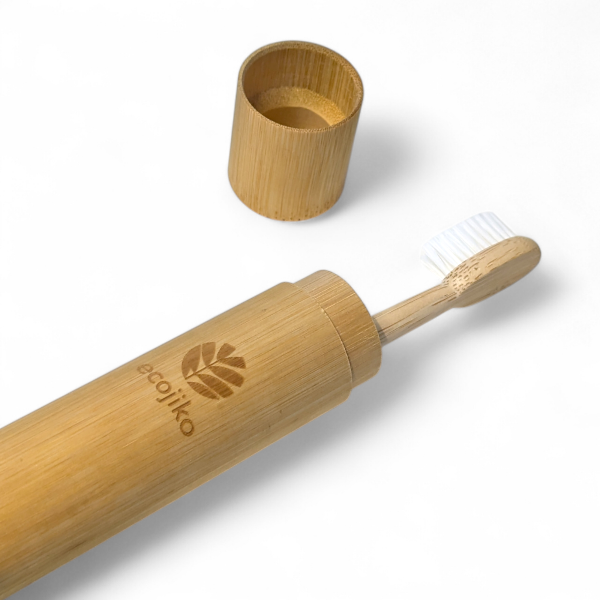 Bamboo toothbrush case with bamboo toothbrush inside and ecojiko branding on a white background