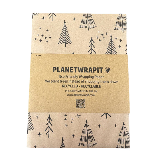 PlanetWrapIt recycled kraft wrapping paper in Christmas trees black (brown paper with printed black Christmas trees) with paper PlanetWrapIt label