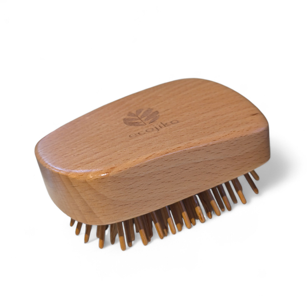 Wooden detangling hairbrush with bamboo bristles on a white background