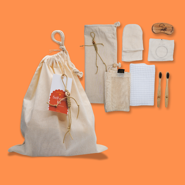 Moonie sustainable self-care with items shown alongside cotton bag on an orange background 