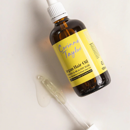 Corinne Taylor natural argan hair oil in glass bottle with oil dropper