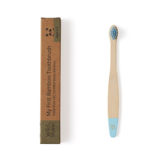 Blue baby bamboo toothbrush from Wild and Stone for gentle oral care, featuring soft bristles and a natural bamboo handle.