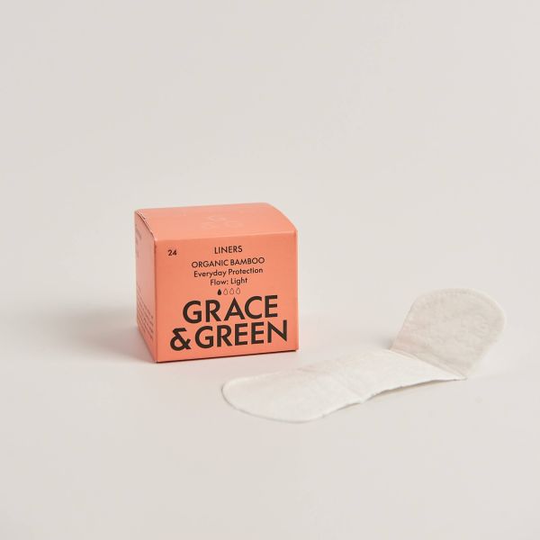 Box of Grace & Green organic bamboo liners with a liner alongside, on a light background