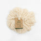 Organic cotton bath puff shown with paper label