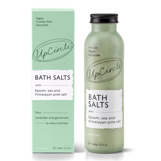 UpCircle bath salts in glass bottle and cardboard packaging on a white background