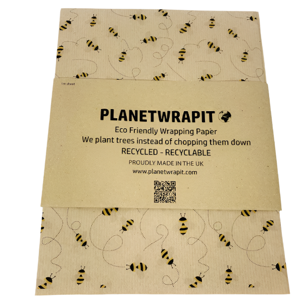Eco-friendly recyclable wrapping paper in bees design (brown paper with little bees flying around) shown as single sheet