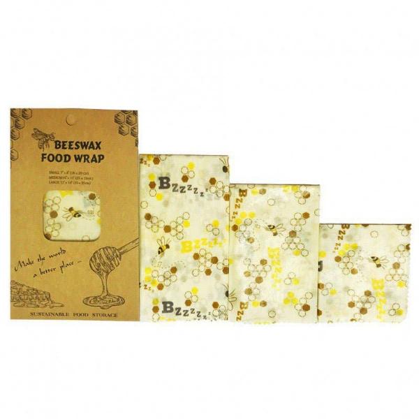 Beeswax food wrap set in Bzzzz bee design (bees and honeycombs on a cream background fabric) with cardboard packaging on a white background