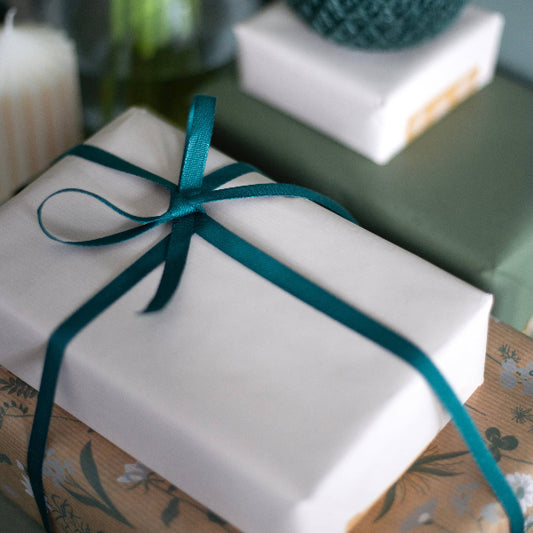 Dark green biodegradable ribbon on a 5m reel, 9mm wide, ideal for wrapping, from Cascayde.