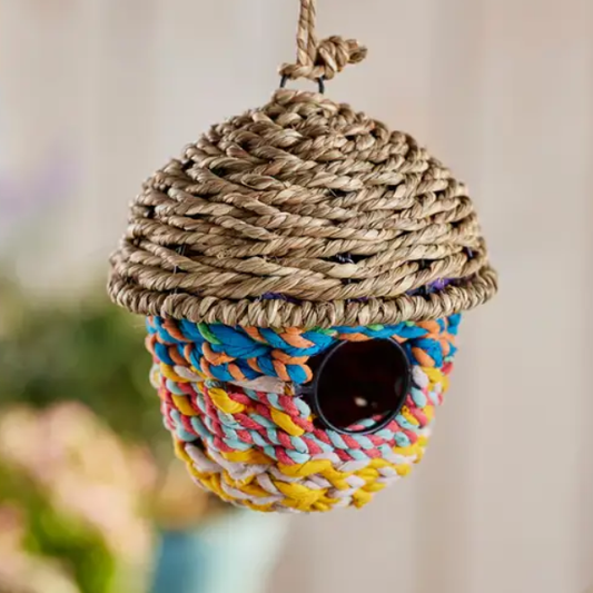 Grass and recycled sari birdhouse in the shape of an acorn