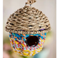 Grass and recycled sari birdhouse in the shape of an acorn