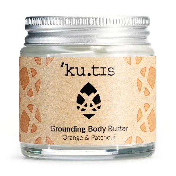 Jar of Kutis grounding body butter in Orange and Patchouli on a white background