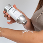 Corinne Taylor natural talc-free body powder in aluminium tin being applied to skin