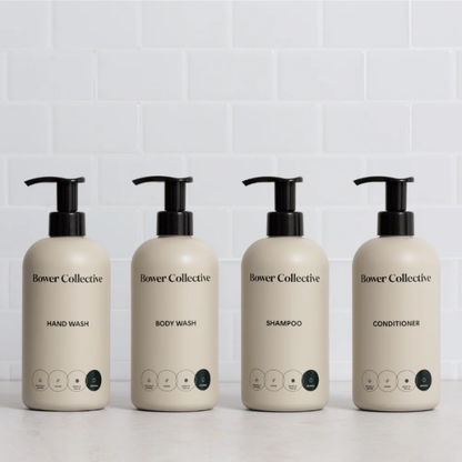 Bower Collective skincare product dispensers on a white background (hand wash, body wash, shampoo, conditioner)