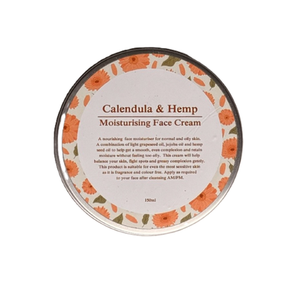 A round metal tin of Calendula & Hemp Moisturising Face Cream, featuring a white label decorated with orange calendula flowers and green leaves, on a plain white background.