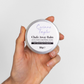 Corinne Taylor Chafe Away balm shown in a hand in aluminium tin