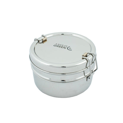 Stainless steel stackable round lunch boxes shown stacked together on a white surface, featuring the brand 'A Slice of Green'.