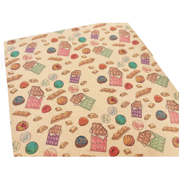 Handmade recycled wrapping paper in Chocolates designs (brown kraft paper with and-drawn style colourful chocolate bars and pieces of chocolate) shown close up