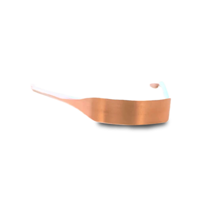 Copper tongue scraper on a white background