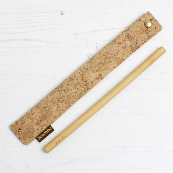 Cork sleeve for reusable straw shown alongside bamboo straw