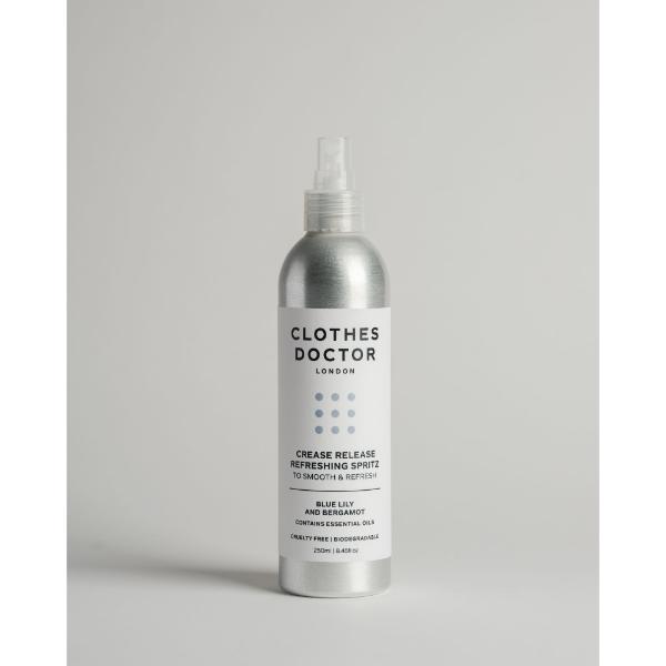 Crease release refreshing clothing spritz in aluminium bottle with spray top on a grey background
