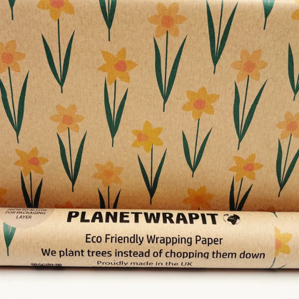 Planetwrapit eco-friendly wrapping paper with daffodil design on brown kraft paper shown close up