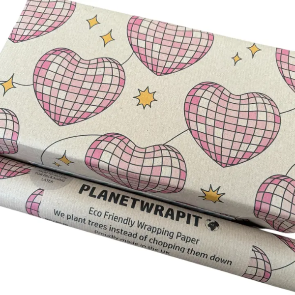 Disco hearts wrapping paper - brown kraft paper with pink disco ball patterned love hearts on a wrapped gift