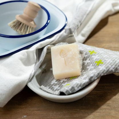EcoLiving dish soap bar and pot brush set for effective cleaning, featuring a biodegradable soap bar and natural scrub brush.
