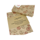 Eco-friendly recyclable wrapping paper in doughnuts design (brown paper with pink and white sprinkled doughnuts) shown alongside a wrapped box