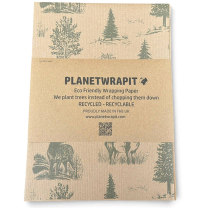 PlanetWrapit eco-friendly wrapping paper, featuring forest and stag illustrations in green on a brown kraft paper background.