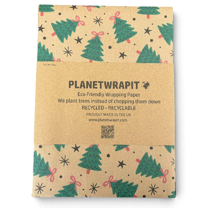Planetwrap eco-friendly wrapping paper in a kraft paper style with a green Christmas tree pattern and a central brown paper band featuring the brand name and product details.