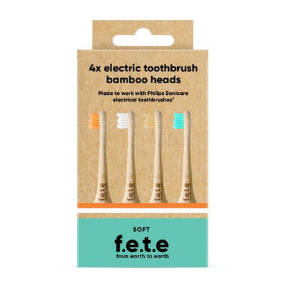 Cardboard packaging containing four soft electric toothbrush bamboo heads. The kraft-paper box shows four brush heads with different bristle colours (orange, white, beige, and light blue). 