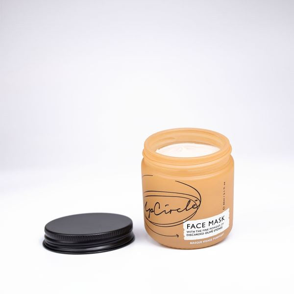 UpCircle face mask in glass jar shown with  lid off and product inside